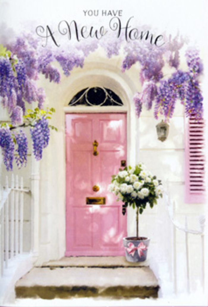 In this Bloomsbury scene, the entrance to a new home becomes a canvas for soft colour and floral storytelling. A pale pink door, painted in a muted, slightly dusty hue, is the central motif, its smooth yet subtly brushed surface giving it a hand-finished charm. The door is embraced by sweeping garlands of wisteria that cascade from above in shades of lavender, lilac, and soft purple-grey. Each trailing cluster of blossoms appears weightless, hanging delicately from slender stems that twist and climb around the frame, and casting whisper-light shadows that play across the adjacent whitewashed wall. The overall effect is romantic and slightly nostalgic, akin to wandering down a tucked-away street off Gower Street or finding a hidden corner near Bloomsbury's literary haunts. At the threshold, a modest grey metal bucket has been transformed into a miniature focal point. It overflows with white and cream roses, their cupped blooms perfectly open, petals plush and full, each flower placed with a florist's attentive care. Sprigs of soft green foliage braid gently through the composition, breaking up the ivory tones and giving the bouquet life and movement. Around the base of the bucket, a satin pink ribbon is tied in a smooth bow, its ends curving gracefully and mirroring the drape of the wisteria above. The scene feels hushed yet hopeful, as if captured in the pause between carrying in the last box and closing the door on the outside world for the first time. The imagined fragrances of rose and wisteria mingle with the coolness of old stone steps and nearby plane trees, creating a sensory suggestion of comfort, renewal, and the promise that this Bloomsbury doorway will soon witness countless cherished arrivals and departures.